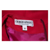 ARMANI Magenta Drape Silk Cocktail Dress Size 8-10. This Armani cocktail dress is composed of a magenta silk with a side draped design. Features a zipper closure. In excellent pre-owned condition, barely worn, if ever.