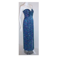BOB MACKIE  Circa 1980 Strapless Beaded Gown. This is a long, multi colored, silk beaded gown by Bob Mackie, from 1980. The gown is strapless with beading all over, a constructed bustier, and a zipper up the back. This beaded gown by Bob Mackie is available to be viewed privately in our Beverly Hills boutique couture salon during business hours. Please telephone us with any questions or if you wish to set up a private appointment to view it personally. Please feel free to contact us anytime should you be lo