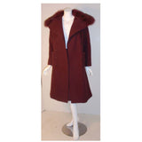 CHRISTIAN DIOR 1971 3 pc Burgundy Wool Coat Set. This is an Haute Couture three 4 piece ensemble by Christian Dior Haute Couture, from the winter collection 1971. It includes a burgundy wool double breasted coat with two front open square pockets, fox fur collar, and suede belt