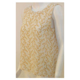 Chanel 2 pc Cream & Yellow Silk Blouse and Tank Set.This is a two piece cream and yellow print silk blouse and tank set by Chanel, from the 1990's. The blouse has five gold logo buttons down the front and two open patch pockets. The tank has a scoop neckline with top stitching detail. Measurements:BlouseLength(Shoulder to hem): 27"Shoulder to shoulder: 16"Sleeve: 22 1/2"Bust: 40"Waist: 40"Hip: 42"TankLength: 22 1/2"Bust: 38"Waist: 39"Hip: 40"