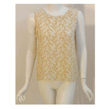Chanel 2 pc Cream & Yellow Silk Blouse and Tank Set.This is a two piece cream and yellow print silk blouse and tank set by Chanel, from the 1990's. The blouse has five gold logo buttons down the front and two open patch pockets. The tank has a scoop neckline with top stitching detail. Measurements:BlouseLength(Shoulder to hem): 27"Shoulder to shoulder: 16"Sleeve: 22 1/2"Bust: 40"Waist: 40"Hip: 42"TankLength: 22 1/2"Bust: 38"Waist: 39"Hip: 40"