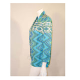 EMILIO PUCCI 1970s Mint Green & White Cotton Print Jacket. Made exclusively for Saks Fifth Avenue by Emilio Pucci Italy. Comprised of a blue, green and white abstract print cotton, with the signature "Emilio" throughout the pattern. The front closure snaps all the way down on a separate panel. There is no lining.Size: 12Measurements: Bust: 38"Sleeve: 21"Shoulder to shoulder: 17"Length: 26"