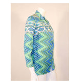 EMILIO PUCCI 1970s Mint Green & White Cotton Print Jacket. Made exclusively for Saks Fifth Avenue by Emilio Pucci Italy. Comprised of a blue, green and white abstract print cotton, with the signature "Emilio" throughout the pattern. The front closure snaps all the way down on a separate panel. There is no lining.Size: 12Measurements: Bust: 38"Sleeve: 21"Shoulder to shoulder: 17"Length: 26"