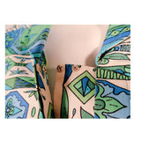 EMILIO PUCCI 1970s Mint Green & White Cotton Print Jacket. Made exclusively for Saks Fifth Avenue by Emilio Pucci Italy. Comprised of a blue, green and white abstract print cotton, with the signature "Emilio" throughout the pattern. The front closure snaps all the way down on a separate panel. There is no lining.Size: 12Measurements: Bust: 38"Sleeve: 21"Shoulder to shoulder: 17"Length: 26"