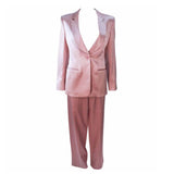 GIORGIO ARMANI Pink Mauve Silk Pant Suit with Beaded Mesh Body Suit Size 42. This Giorgio Armani pant suit is composed of a pink mauve hue silk, comes with a brown beaded mesh bodysuit. The jacket has a center front button closure, and the pants feature a zipper closure. In excellent condition