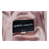 GIORGIO ARMANI Pink Mauve Silk Pant Suit with Beaded Mesh Body Suit Size 42. This Giorgio Armani pant suit is composed of a pink mauve hue silk, comes with a brown beaded mesh bodysuit. The jacket has a center front button closure, and the pants feature a zipper closure. In excellent condition