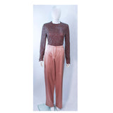 GIORGIO ARMANI Pink Mauve Silk Pant Suit with Beaded Mesh Body Suit Size 42. This Giorgio Armani pant suit is composed of a pink mauve hue silk, comes with a brown beaded mesh bodysuit. The jacket has a center front button closure, and the pants feature a zipper closure. In excellent condition