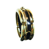 This vintage Givenchy bracelet is composed of a gold tone material and features black accents. Clasp closure. In excellent vintage condition (shows some signs of wear due to age).