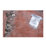 This Givenchy jacket is composed of a soft mauve pink marabou and features rhinestone jewel accents at the shoulders. The base is composed of silk and features a silk organza interior. In excellent condition.