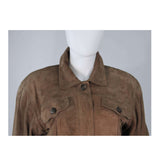 This Gucci jacket is composed of a supple khaki brown hue suede. Features center front button closures, and shoulder pads. In excellent vintage condition.