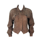 This Gucci jacket is composed of a supple khaki brown hue suede. Features center front button closures, and shoulder pads. In excellent vintage condition.