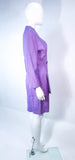 This Thierry Mugler skirt suit is composed of a lavender/purple hue fabric. Features a classic Mugler silhouette with nipped waist and curved bust-line to neckline design. The classic pencil style skirt features a zipper closure. In good vintage pre-owned condition (some signs of wear due to age) the skirt shows signs of alterations. Made in France.