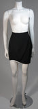 This fabulous Thierry Mugler ensemble is comprised of medium weight wool gabardine with a dramatic sculpted white lapel and cuff detail in white satin. Fitted waist has a single Tri-color abstract square button echoing the white edges of the lapels and cuffs. Medium density shoulder pads. Fitted skirt with a hidden zipper and covered satin snap at back with 3-D white detail at the hem.