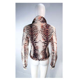 OLEG CASSINI Night Sport Animal Print Sequin Denim Jacket Size 6. This Oleg Cassini jacket is composed of an animal print denim fabric. Features sequin applique throughout & center front zipper closure with front pockets. In excellent vintage condition, some light signs of wear due to age.**Please cross-reference measurements for personal accuracy. Size in description box is an estimation. Measures (Approximately)6Length: 21"Sleeve: 24.5"Shoulder to shoulder: 17"Bust: 40"Waist: 35"
