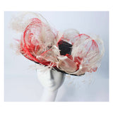 This Saks Fifth Ave. hat is composed of a black base with elastic piece for wear. Features white and red ostrich feathers. In excellent vintage condition.