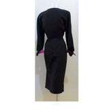 THIERRY MUGLER Black with Pink Lining and Cuff Skirt Suit Size 40. This THIERRY MUGLER skirt suit is composed of a black wool fabric with bright pink lining and cuff. Features a classic Mugler silhouette with nipped waist and curved bust-line to neckline design. The jacket has front snap closures, rounded shoulders, and a scalloped hem. The skirt features a zipper closure, flounce shape, and midi-length. In good vintage pre-owned condition. Made in France.Measurements in Inches:JacketBust: 40 Waist: 29 Skir