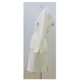 THIERRY MUGLER White Textured Cotton Skirt Suit Size 42. This Thierry Mugler skirt suit is composed of a white textured cotton fabric. Features a classic Mugler silhouette with nipped waist and curved bust-line to neckline design. The jacket has front snap closures, rounded shoulders, and a gathered panel detail at the back. The classic pencil style skirt features a zipper closure. In good vintage pre-owned condition. Made in France.Measurements in Inches:JacketBust: 42 Waist: 30 SkirtWaist: 28Hip: 38Length