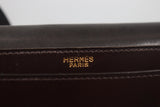 HERMÈS Dark Brown Leather Crossbody Bag with Gold Buckle and Adjustable Strap