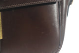 HERMÈS Dark Brown Leather Crossbody Bag with Gold Buckle and Adjustable Strap