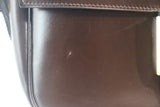 HERMÈS Dark Brown Leather Crossbody Bag with Gold Buckle and Adjustable Strap