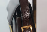 HERMÈS Dark Brown Leather Crossbody Bag with Gold Buckle and Adjustable Strap