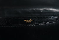 HERMÈS Black Leather Crossbody Bag with Silver Buckle and Adjustable Strap