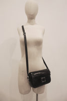 HERMÈS Black Leather Crossbody Bag with Silver Buckle and Adjustable Strap