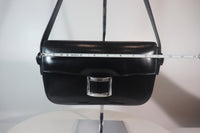 HERMÈS Black Leather Crossbody Bag with Silver Buckle and Adjustable Strap