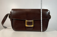 HERMÈS Dark Brown Leather Crossbody Bag with Gold Buckle and Adjustable Strap