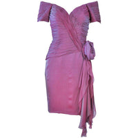Vicky Tiel Lavender Silk Iridescent Cocktail Dress Size 38. This Vicky Tiel dress is composed of an iridescent lavender hue silk. Features a large rose and draping with a ruched bodice. There is a center back zipper closure. In excellent vintage condition. **Please cross-reference measurements for personal accuracy. Measures (Approximately) Length: 31" Sleeve: 6" Bust: 30" Waist: 26" Hip: 34"