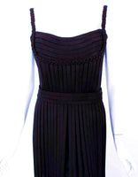 This is an incredible black silk jersey "No Strings Attached" gown, by Elizabeth Mason Couture. The gown is fitted to the body with loose flowing "strings", and braided detail.  This is a custom made gown. It can be made in any size, color, or fabric. Couture orders take approximately forty five days from design to fittings completion. 
