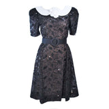ARNOLD SCAASI Belle De Jour Black Sequin Lace Cocktail Dress Size 10. This Arnold Scaasi cocktail dress is composed of black lace with sequin embellishment. Features a center back zipper closure and contrast white collar with puff sleeves. In excellent vintage condition.