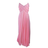 ARNOLD SCAASI Pink Draped Chiffon Gown with Criss-Cross Bodice Size 4-6. This Arnold Scaasi gown is composed of a pink chiffon. The bodice has a criss-cross design. The skirt features a drape style. There is a center back zipper closure with bow accent. In very good condition with some minor fading.