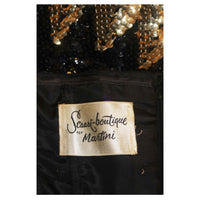 This Scaasi gown is composed of a sequined knit in black and gold hues with a zig zag pattern. There is a center back zipper and bustier foundation. In excellent great vintage condition. 