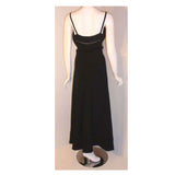 CHRISTIAN DIOR 1970S 2pc Black Gown w/ Shawl. This is a 2pc black gown with a matching shawl by Christian Dior Haute Couture, from the 1970's. The dress has thin straps, a tie bow around the waist, a v-neckline, and faggoting cut-out detail on the bust and hemline.Provenance Betsy Bloomingdale 