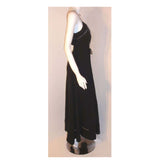 CHRISTIAN DIOR 1970S 2pc Black Gown w/ Shawl. This is a 2pc black gown with a matching shawl by Christian Dior Haute Couture, from the 1970's. The dress has thin straps, a tie bow around the waist, a v-neckline, and faggoting cut-out detail on the bust and hemline.Provenance Betsy Bloomingdale 