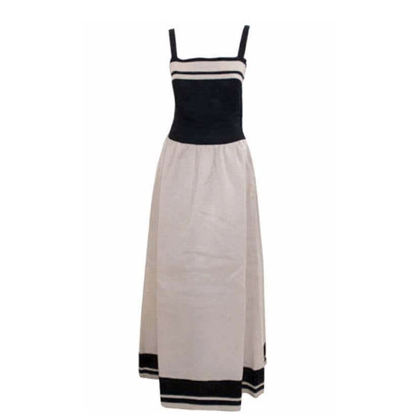 This is a black and white long "sailor" style day dress by Christian Dior Haute Couture, from 1980. This dress has a full skirt with gathers at the hip, and a 16" zipper on the side seam. Provenance: Betsy Bloomingdale