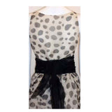 CHRISTIAN DIOR 1980s Polka Dot Chiffon Gown. This is a sheer chiffon black and white polka dot gown by Christian Dior Haute Couture, from 1980. The gown has an open slit up the front and comes as a three piece set, with a matching scarf and black chiffon belt