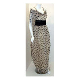 CHRISTIAN DIOR 1980s Polka Dot Chiffon Gown. This is a sheer chiffon black and white polka dot gown by Christian Dior Haute Couture, from 1980. The gown has an open slit up the front and comes as a three piece set, with a matching scarf and black chiffon belt
