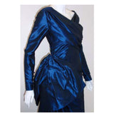 CHRISTIAN DIOR 1988 Long Blue Gown. This is a long royal blue silk taffeta gown by Christian Dior Haute Couture, from 1988-89. The gown has long sleeves, a wrapped front and back bodice, a large bow on the side hip, and two long trains