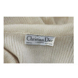 CHRISTIAN DIOR Cashmere Blend Tie Front Sweater with Ruffled Edges Size 6.This Christian Dior sweater is composed of an off white knit cashmere blend. Features a ruffled edge with satin trim and tie front style closure. In excellent vintage condition. 