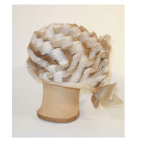 CHRISTIAN DIOR Chapeaux Woven Textured Net Bubble Hat w/ Bow 1960's. Woven raffia and net with a side bow. Minor soiling around edge. Measurements:21" 5" high crown