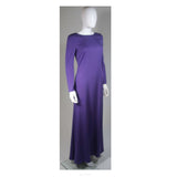 This Emilio Pucci gown is composed of a radiant soft purple silk. The classic long sleeve style is modernized with an exquisite open back. There is a side zipper closure and center back top button. In excellent condition. 