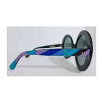 EMILIO PUCCI Round Print Sunglasses w/ Case. These Emilio Pucci round plastic sunglasses feature a classic blue, green, and purple print. The lenses are black. They come with a baby blue leather case. Made in France. Measurements in Inches: Width: 6.5 Height: 3Length: 5.5