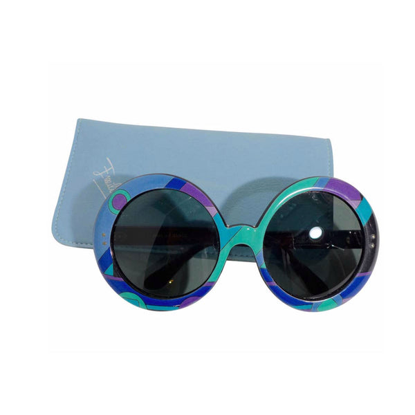 EMILIO PUCCI Round Print Sunglasses w/ Case. These Emilio Pucci round plastic sunglasses feature a classic blue, green, and purple print. The lenses are black. They come with a baby blue leather case. Made in France. Measurements in Inches: Width: 6.5 Height: 3Length: 5.5