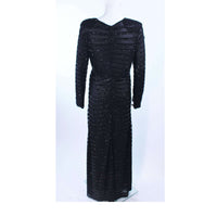 GIORGIO ARMANI Black Beaded Sheer Mesh Gown Size 42. This Giorgio Armani gown is composed of a beaded sheer mesh. There is a center back zipper closure. In excellent vintage condition