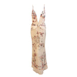 This is an elegant floral print chiffon gown with silver and pink rhinestones by Giorgio Armani, from the 1990's. The gown has a very deep "V" in the front, a zipper up the side, open back, twisted straps, and gathering at the hip and on the bust panels.