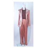 GIORGIO ARMANI Pink Mauve Silk Pant Suit with Beaded Mesh Body Suit Size 42. This Giorgio Armani pant suit is composed of a pink mauve hue silk, comes with a brown beaded mesh bodysuit. The jacket has a center front button closure, and the pants feature a zipper closure. In excellent condition