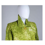 This Givenchy coat of a green leopard print silk. Features front pockets and center front button closures. In excellent vintage condition. 