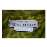This Givenchy coat of a green leopard print silk. Features front pockets and center front button closures. In excellent vintage condition. 